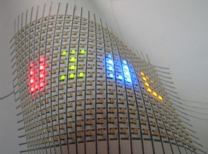 A flexible array of LEDs mounted on paper. Hand-drawn silver ink lines form the interconnects between the LEDs. (Bok Yeop Ahn, University of Illinois)