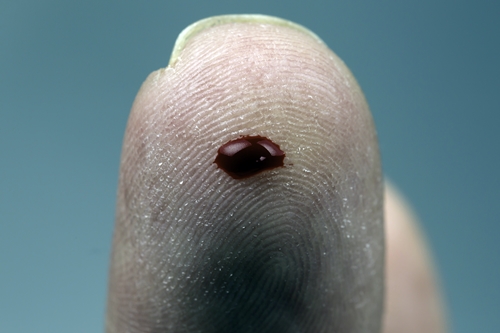 Drop of blood on finger