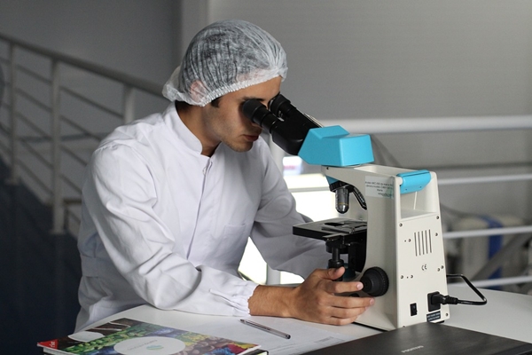 Scientist at microscope