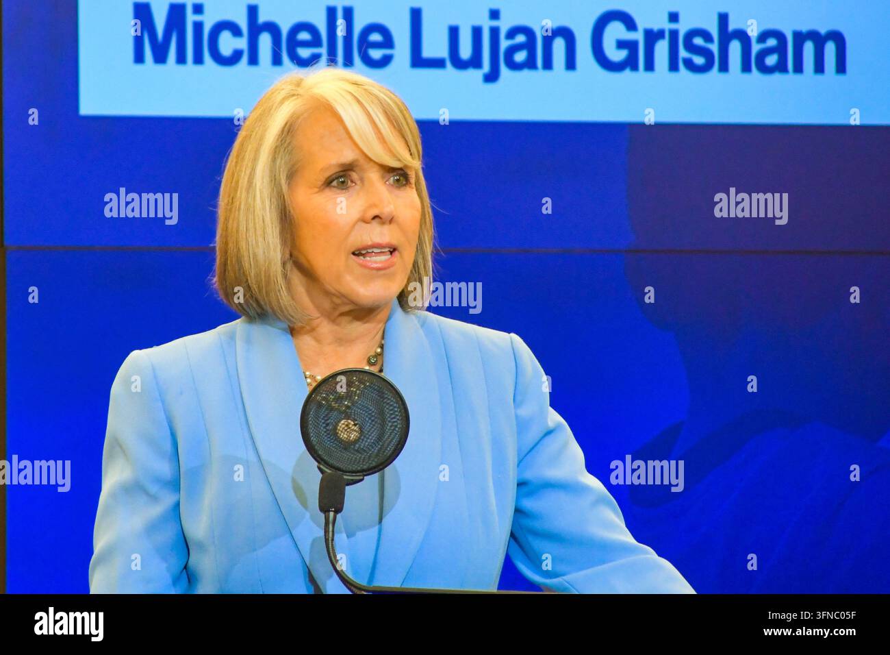 Michelle Lujan Grisham speaking at a lectern