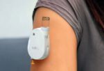 SatioRx wearable drug and vaccine delivery device, worn on the arm
